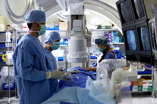 surgeons using medical devices