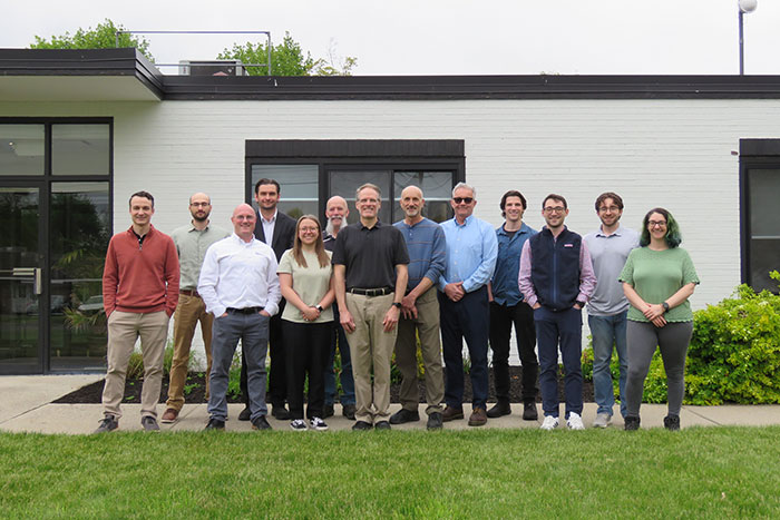 new team pic in front of building